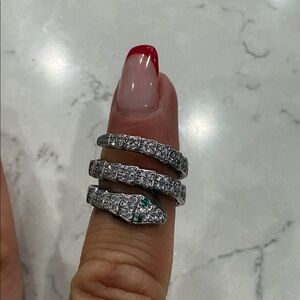 Elegant Silver Snake Ring with Green Accents